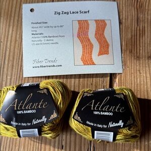 2 skeins Atlante gold 100% Bamboo Yarn with directions to knit lace scarf.